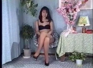 Japanese lady putting on long girdle.