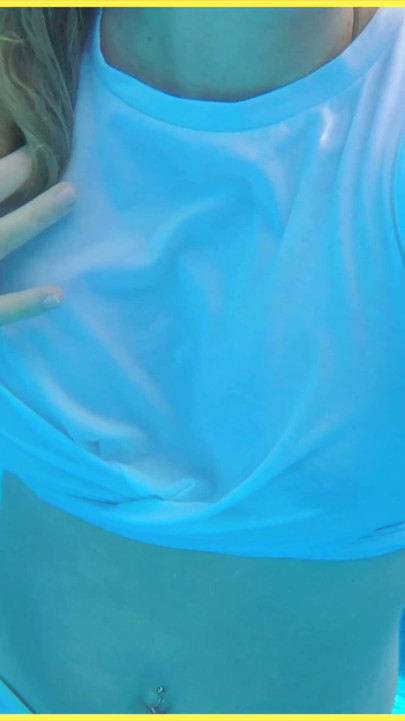 Wifey goes for a swim in a white shirt braless which shows her perfect tits in the water | Clip 1