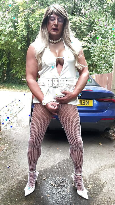 Sexy Crossdresser kellycd2022 in sexy white mini dress and fishnet pantyhose and heels