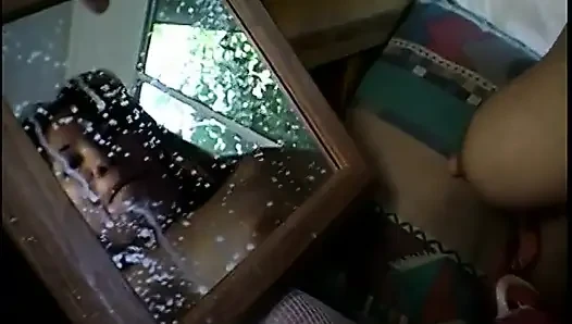 Asian girl is milking her tits in the mirror for you