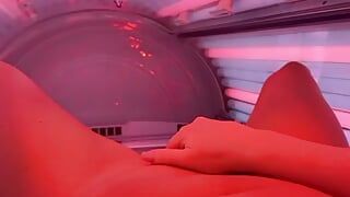 German milf in sun bed uses fingers