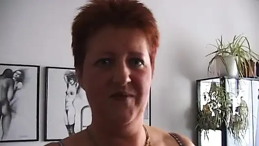 Redhead playing with her fingers and his cock