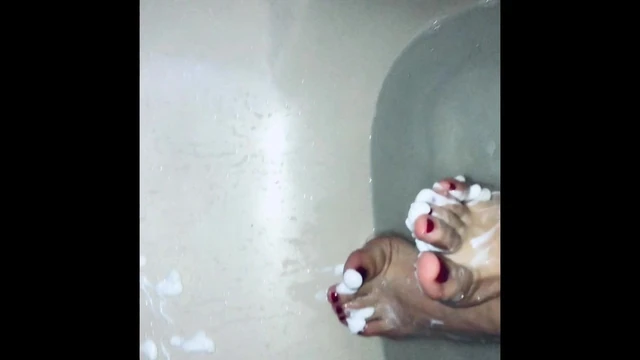 Mistress Andrea Parker's feet take a bath