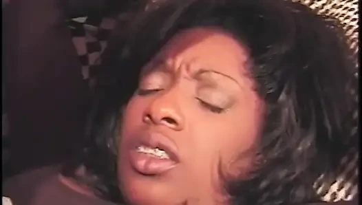 Redhead and brunette busty ebony chicks are blowing cock and getting their asses fucked