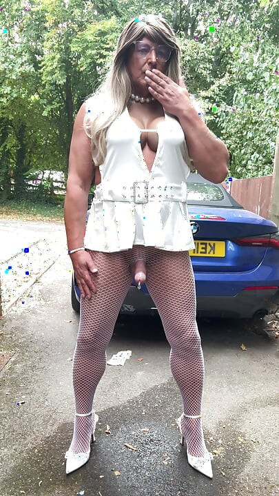 Sexy Crossdresser kellycd2022 in sexy white mini dress and fishnet pantyhose and heels