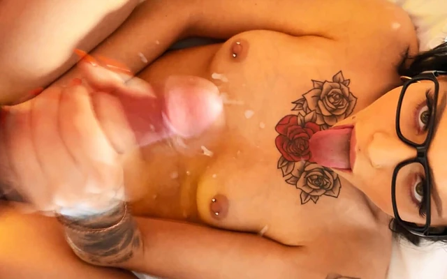 Mutual masturbation and edging handjob leads to an incredibly huge cumshot on tits of cute tattooed girl