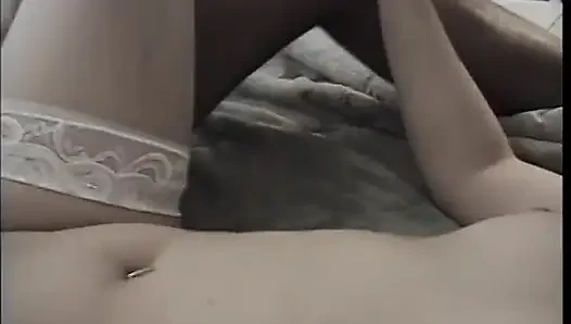 Sexy brunette slut gives head and takes a hard black cock on the bed