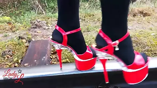 Lady L sexy walking with extreme red high heels.