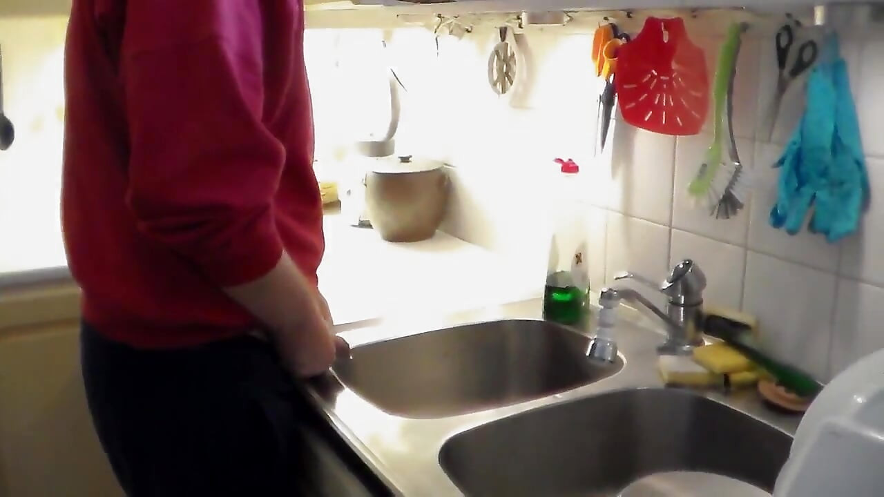 John Is Pissing in the Kitchen Sink