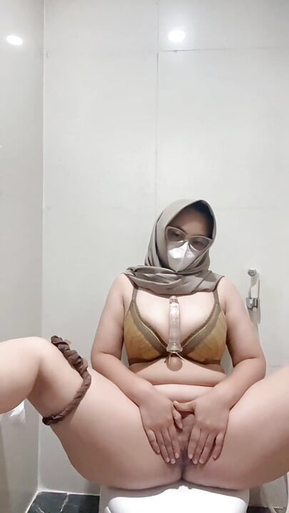 Brutal busty girl in bikini masturbates using squirt tipped dildo
