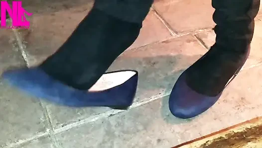 Dangling in Blue Ballet Flats in a Bar