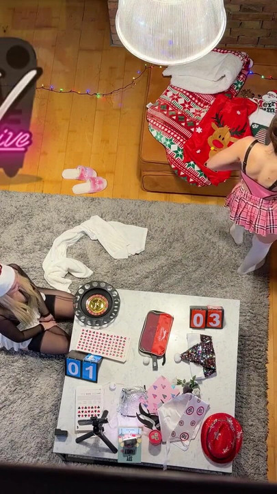 Two girls one guy handjob challenge party for Christmas with presents and roulette spinning | Clip 1