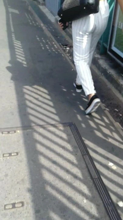 A beautiful ass in a beautiful white pants striped in black
