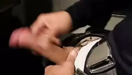 Guy stroking his cock on a plane
