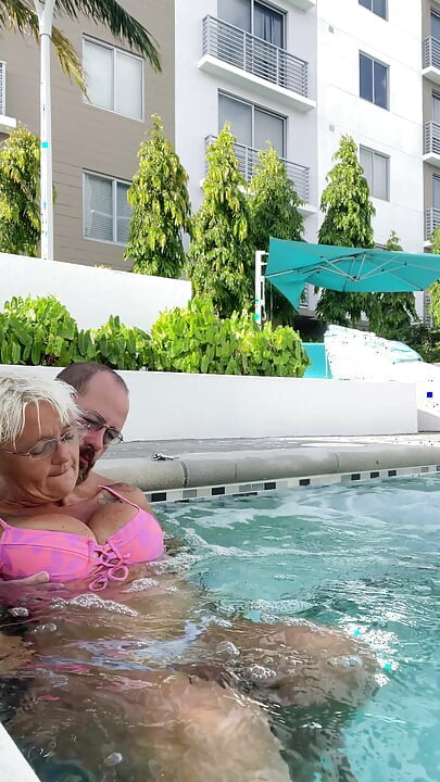 Getting frisky in the hot tub. Boob play.