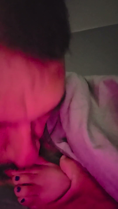Sucking her toes while she watches a movie | Clip 1