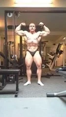 Str8 bodybuilder posing in the gym