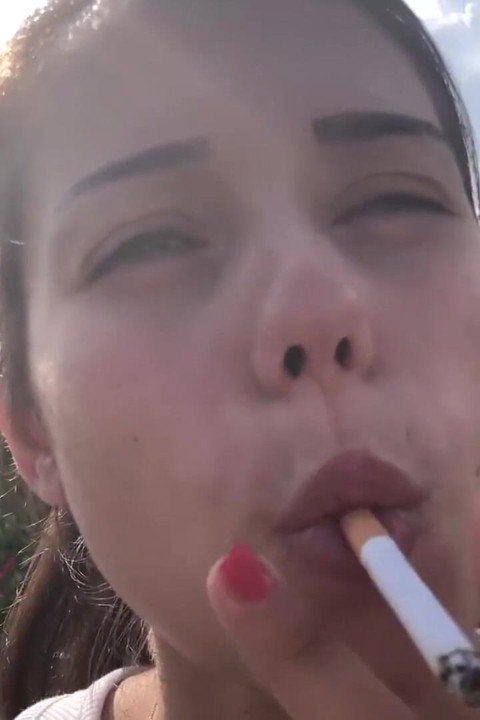 Smoking on bench with hot teen