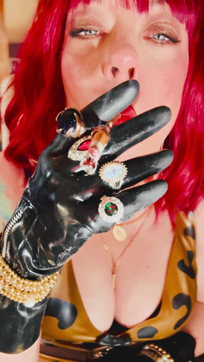 The Beautiful Rubber Beauty Tina Snua Smoking A Cigarette Using A Holder - Smoker Latex Gloves Rings Jewellery | Clip 1