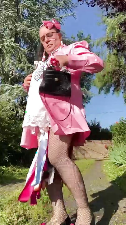 In an outfit with a little pink button dress for an evening.