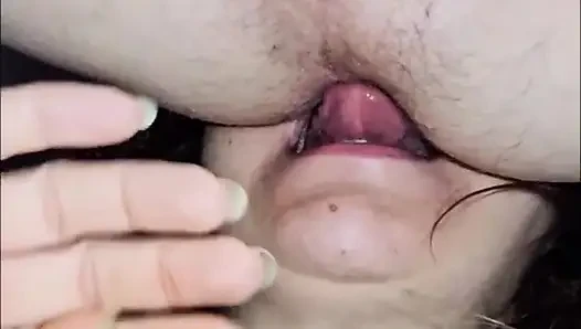 The whore licks her anus
