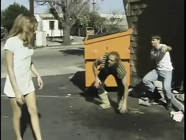 young girl in side street hook by homeless