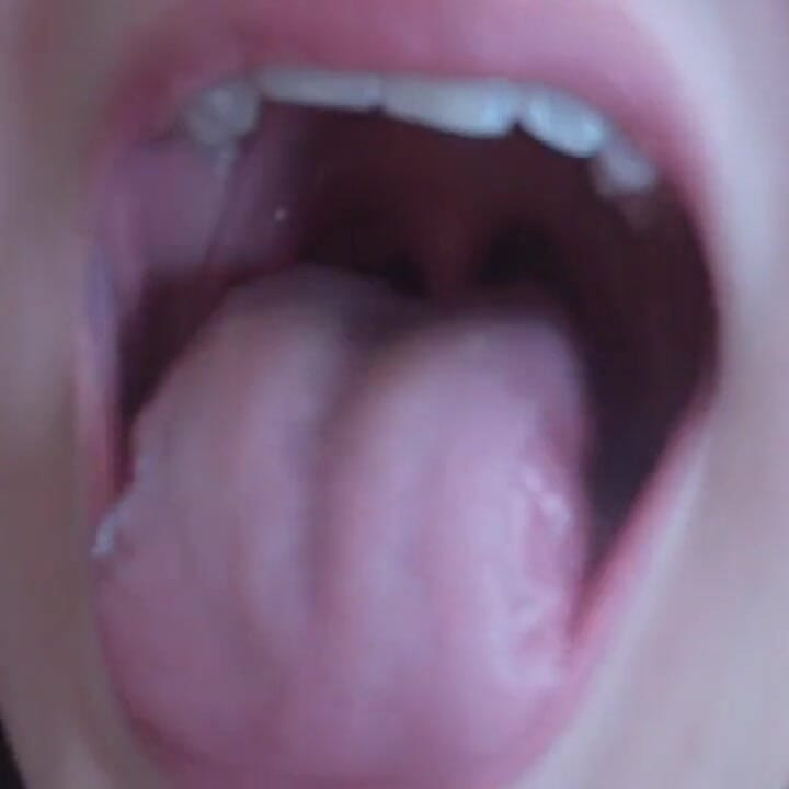 She is showing her pretty tongue in close up