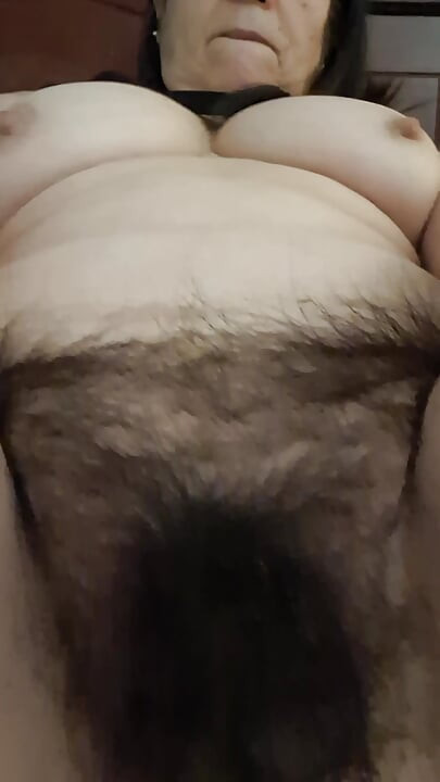 MILF admiring her fat, hairy pussy