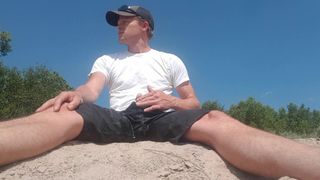 Risky piss and cum on a river bank