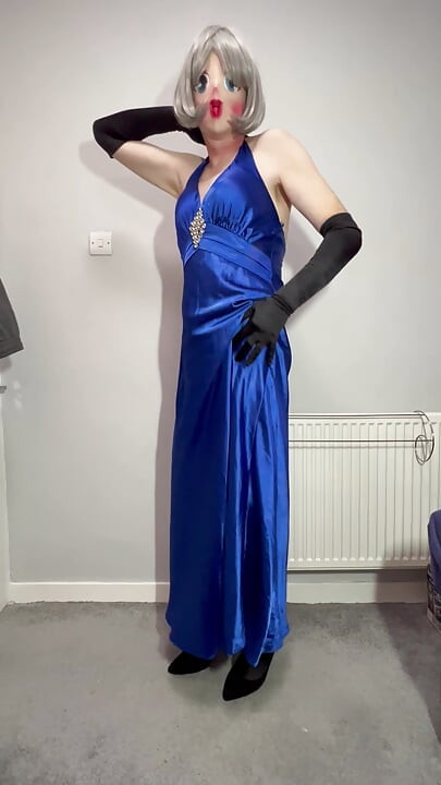 Sissy crossdresser playing in a satin ball gown