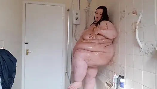 Ssbbw body covered in chocolate sauce in shower