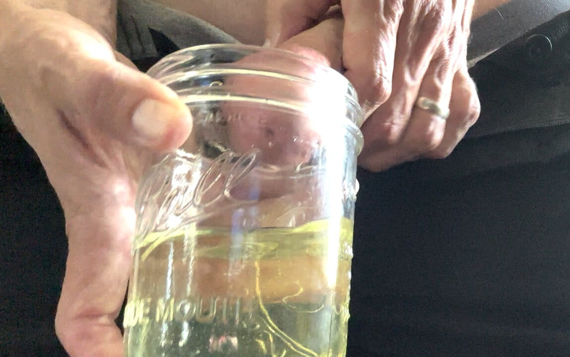 Erotic pissing in jar and masturbation