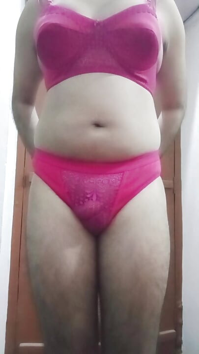 Indian Gay Crossdresser Gaurisissy showing and playing with her big boobs in pink honeymoon lingerie