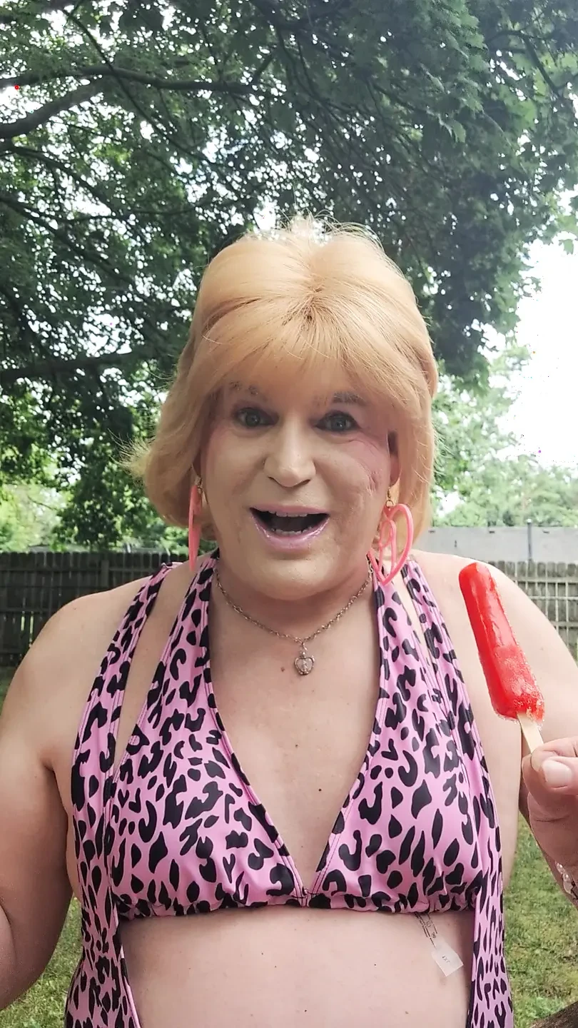 Sucking and enjoying an outside popsicle!
