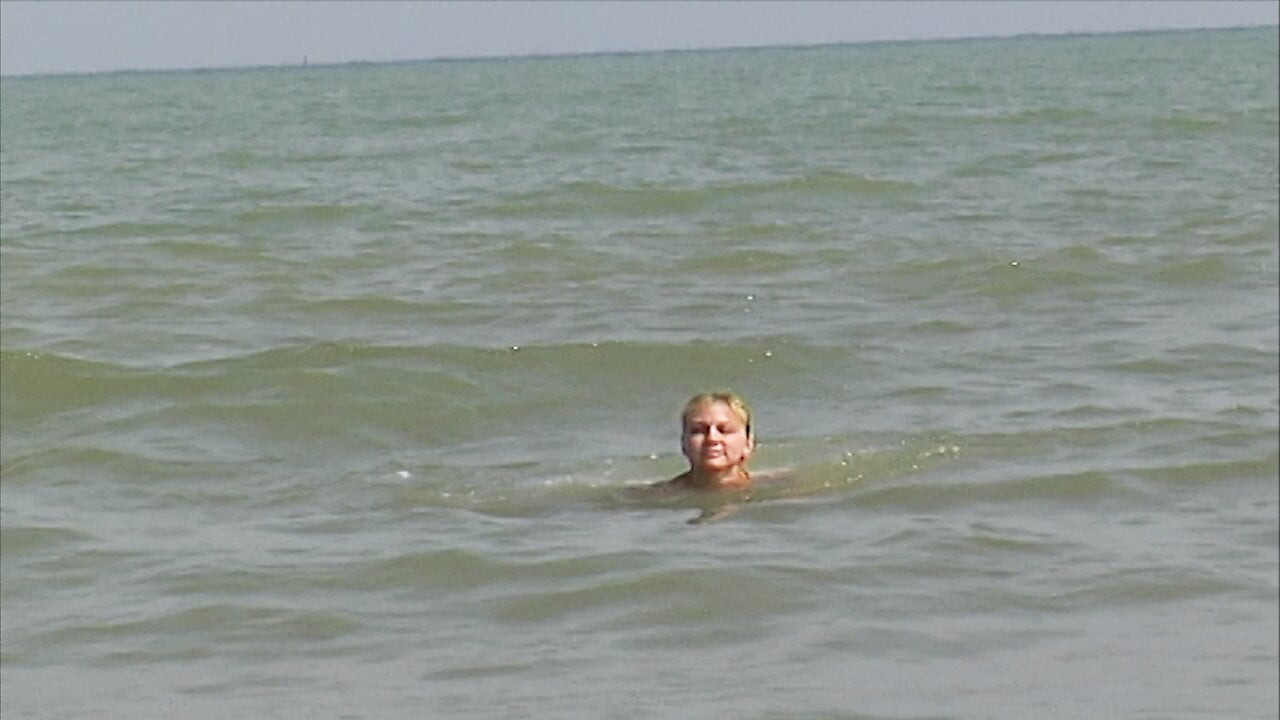 Outstanding blonde chick rubbing her hairy pussy on the beach