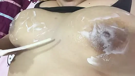 Mom massages her big tits with a very delicious cream