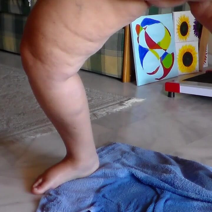 Jen is peeing on a towel in the livingroom