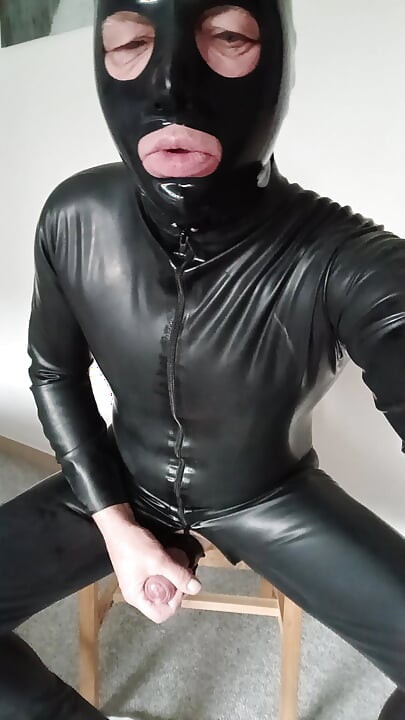 Cumshot in latex suit