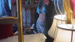 Bella Thorne admiring her abs in a mirror