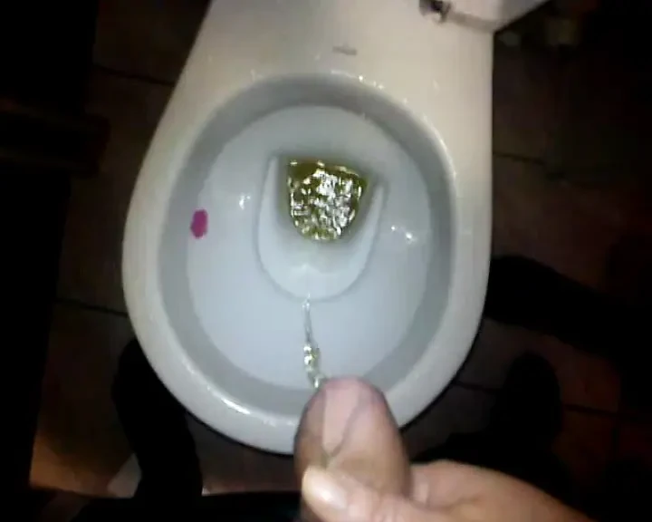 My wife holds my cock when I pee and then we fuck