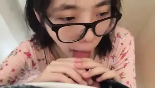 Cute Asian first time eating sausage