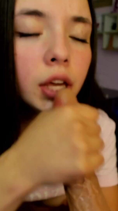 Cute horny young girl with a cute face gets her throat stuffed with a big dildo while a toy vibrates inside her pussy | Clip 1