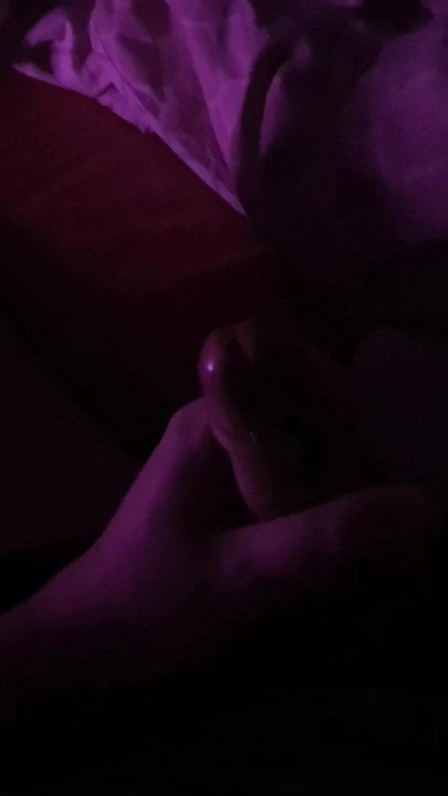 Cumming in purple light