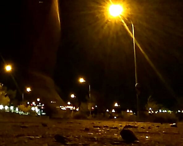 Naked on a quiet street at night