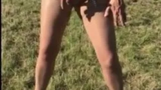 Milf brunette pees her knickers in a field