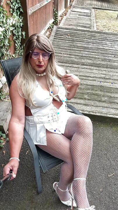 Sexy Crossdresser kellycd2022 in sexy white mini dress and fishnet pantyhose and heels