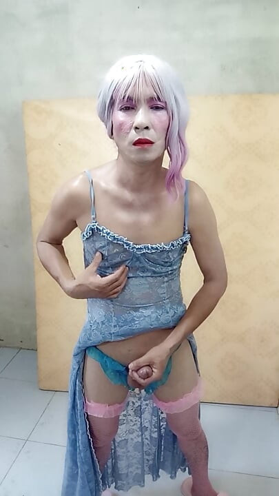 Oanh Le shemale eyes sexy dress porn standing with a happy cock leaning on her back