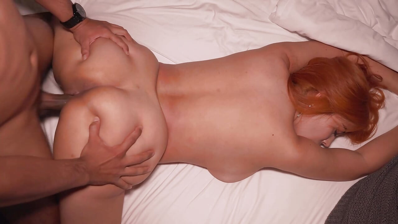 I share the same hotel bed with my stepmother due to a hotel error.