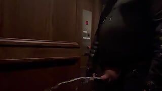 demon having a nice long piss in an elevator