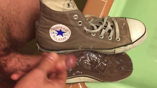 Grey Converse high tops.
